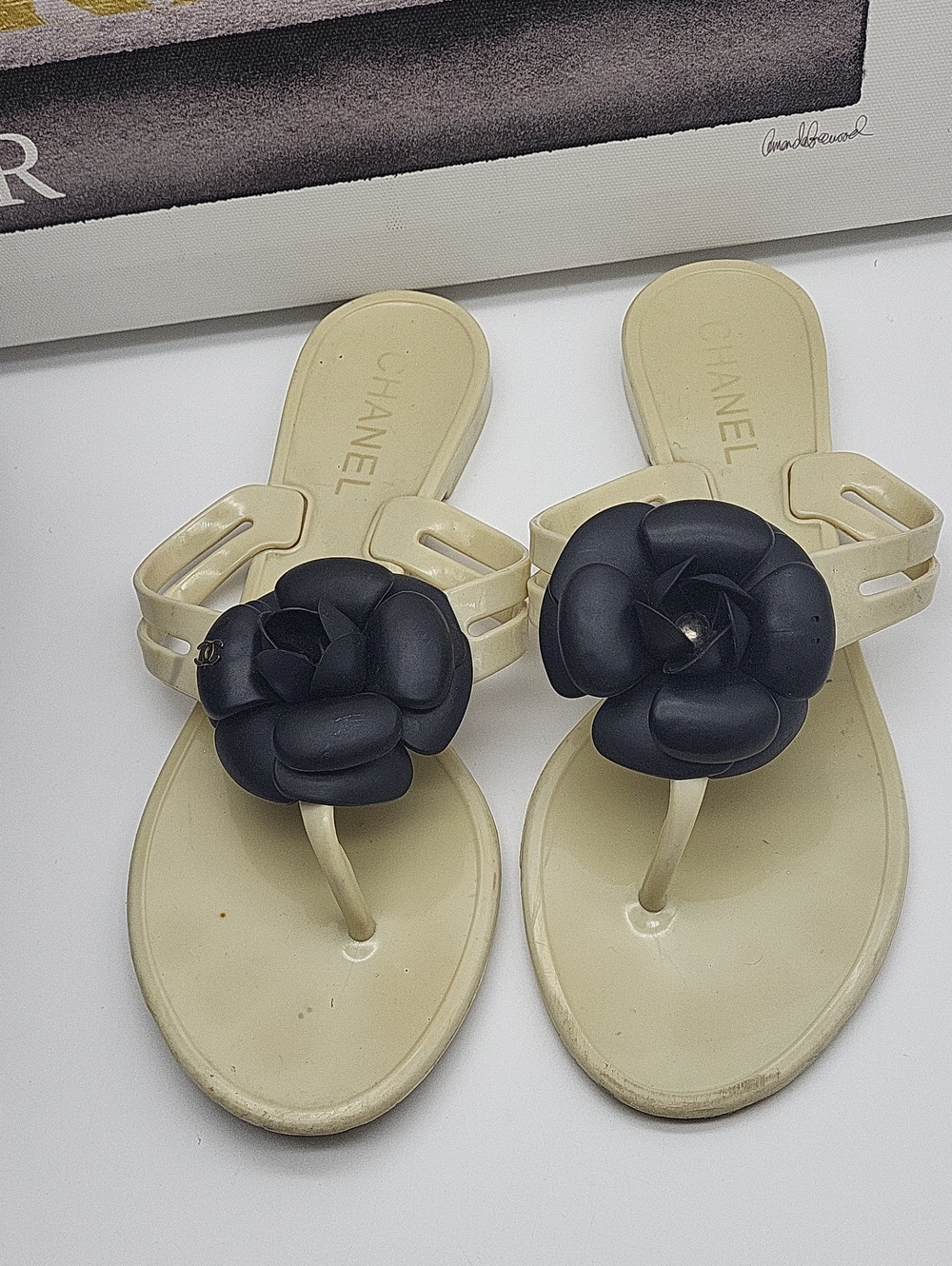 CHANEL Ivory Jelly Thong Sandals with Black Camellia Flower